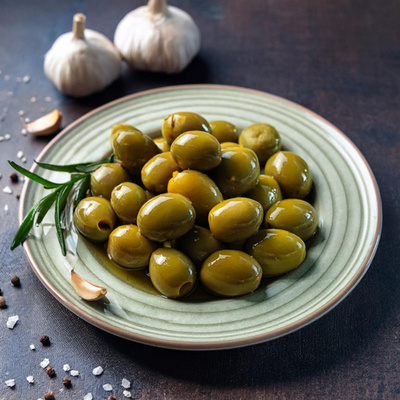 Produktfoto zu Grüne Oliven mit Knoblauch, mariniert